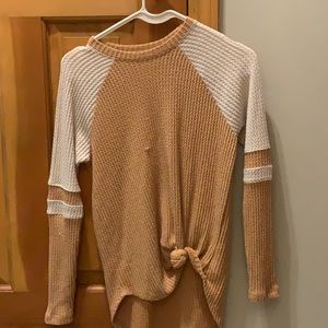 Long sleeve beige brown and white shirt.